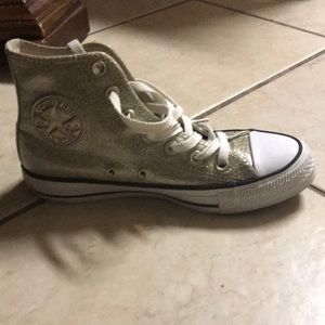 Gold glittery converse.